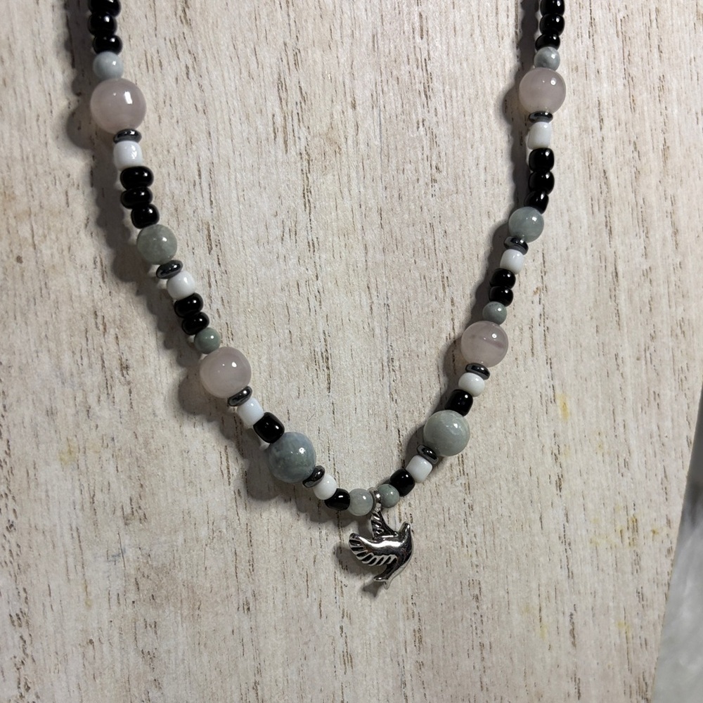 Elegant Beaded Necklace with Dove Pendant